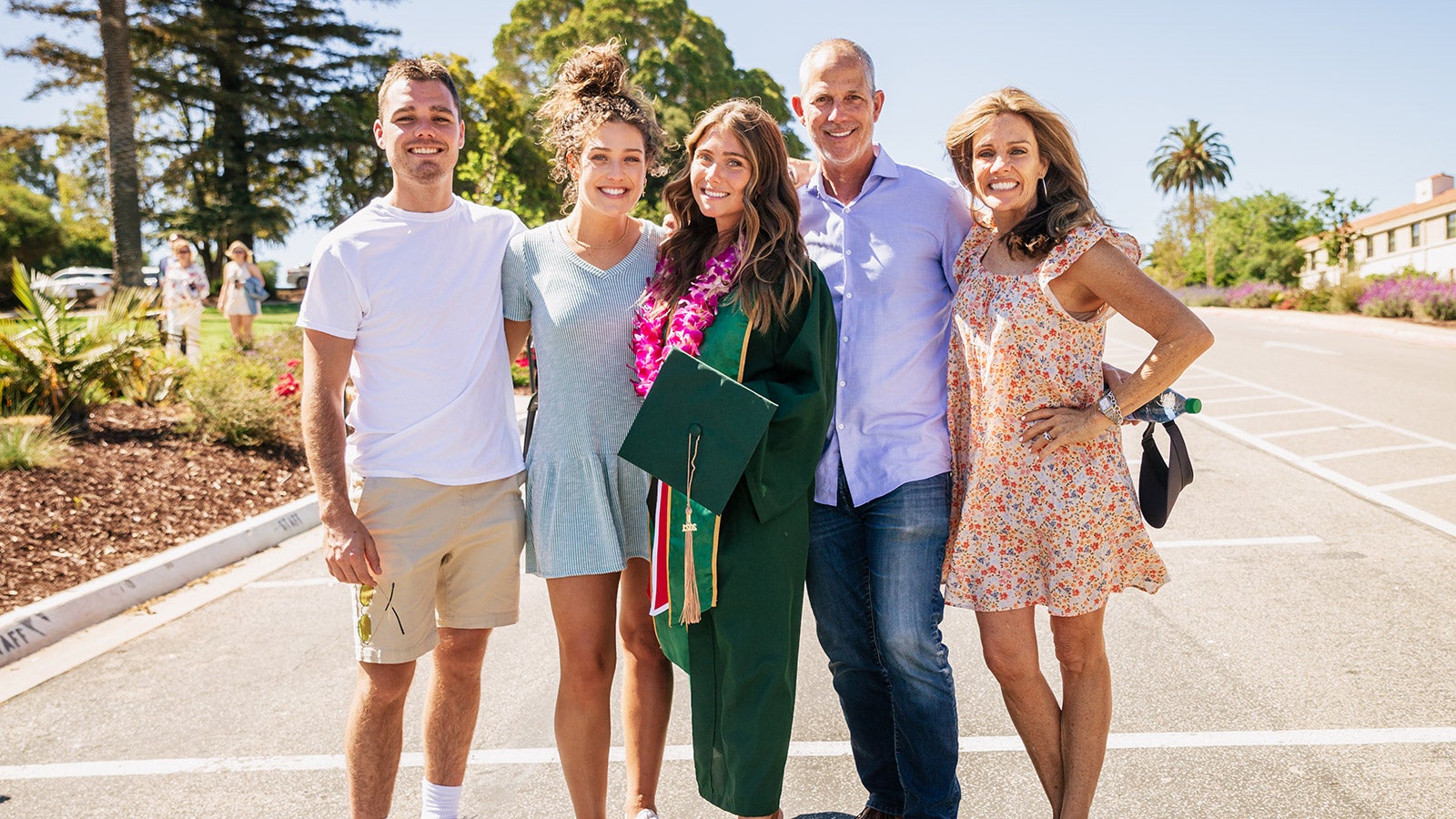 OCOB Grad with Family at Commencement