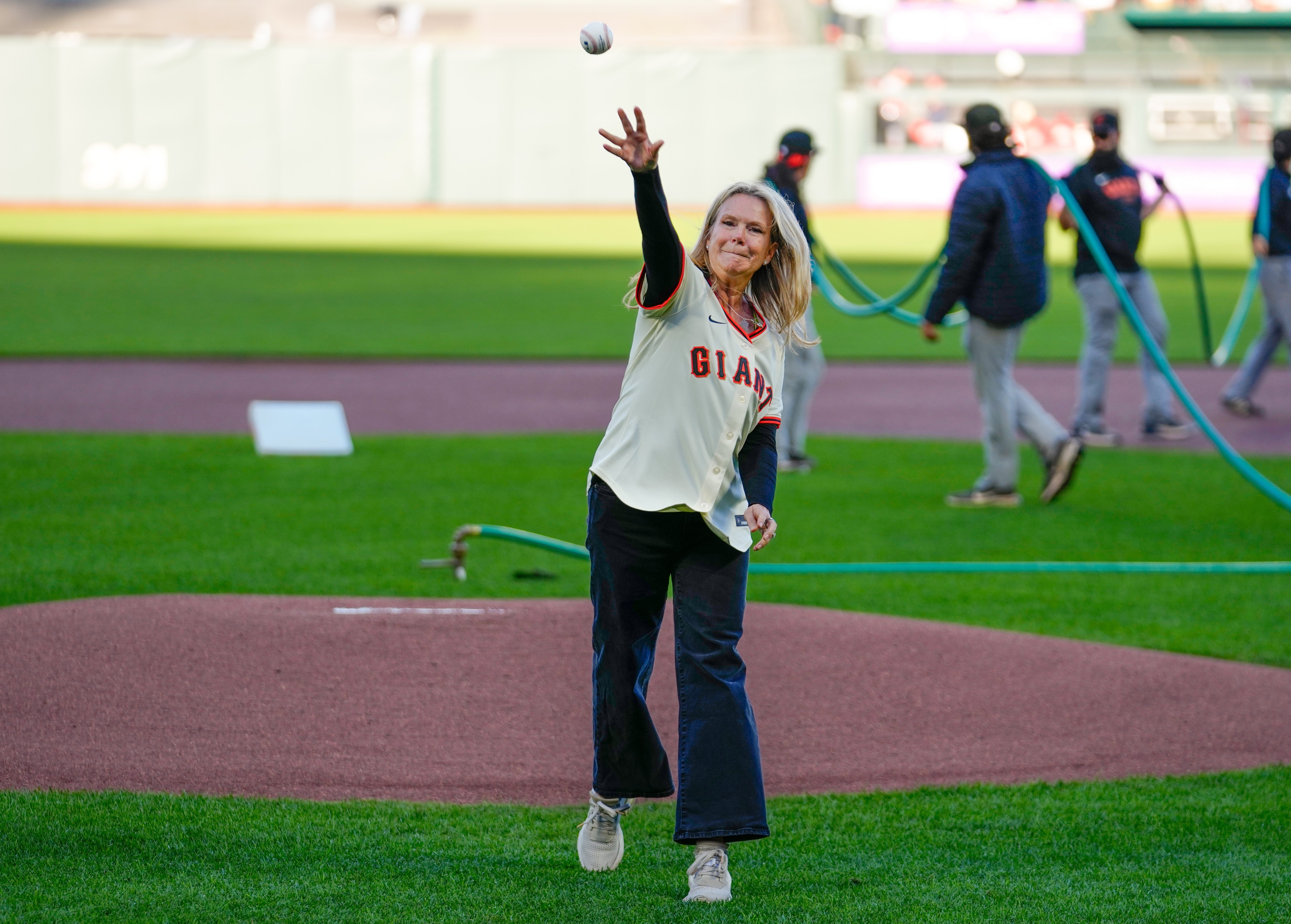 An image of Capt. Anne McIntyre throwing out the first pitch at a SF Giants game.
