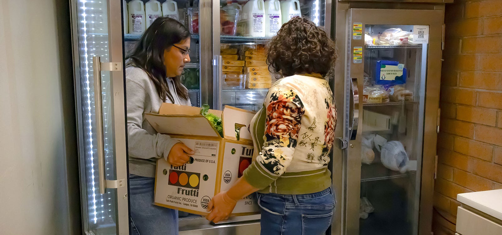Student workers help stock the Cal Poly Food Pantry