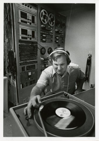 Student at a turntable in the Cal Poly Audiovisual Department Studio.