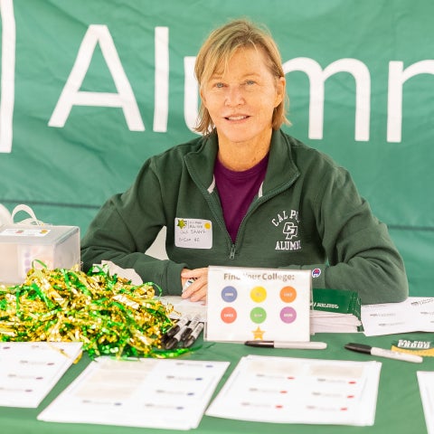 Judi Littell at the 2026 Alumni Wine and Beer Garden check-in table