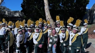 Mustang Band pose for picture. 