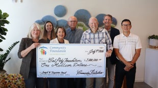 Joseph W. Tripiano Charitable Fund members present a check to Cal Poly for $1 million