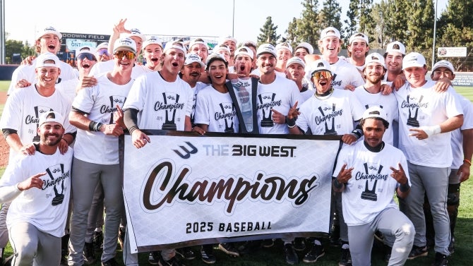 Cal Poly baseball team celebrating with "Champions" shirts and banner after winning the 2025 Big West championship.