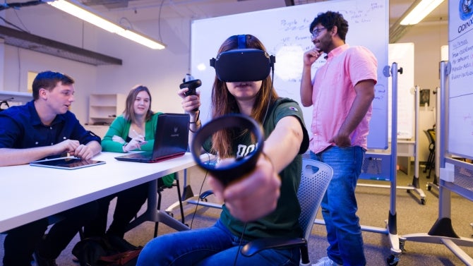 Student using VR headset.