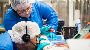 Cal Poly engineering students work on a cubesat