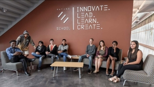 Students of the Patino School pose in front of their school's sign