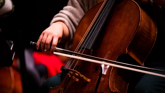 Student playing the cello