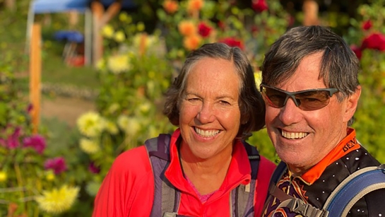 Cindy and Rob Shurtleff take a break while biking in remote Stehekin, Washington, in 2022.