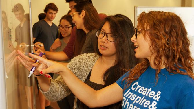 Students working on a whiteboard