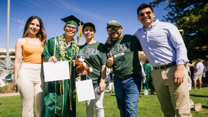 Cal Poly graduate with family at Commencement